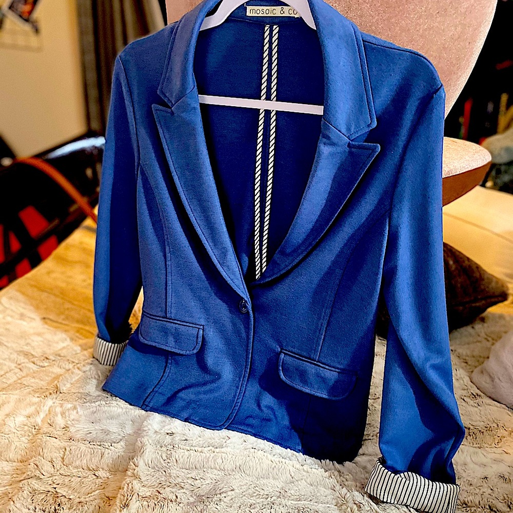 Blue blazer and white pants